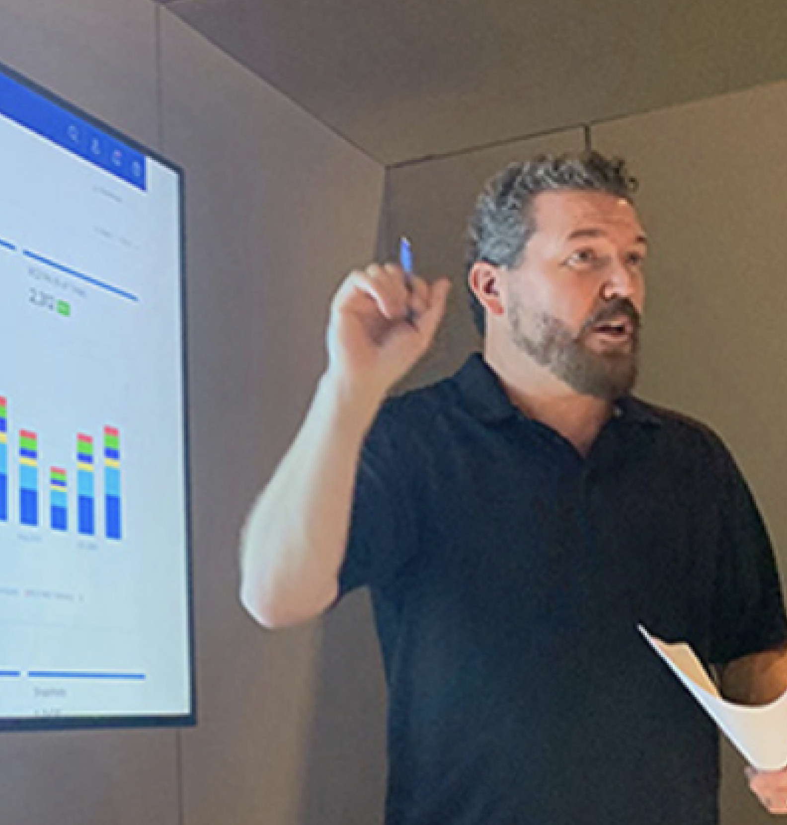 Jay presenting at a whiteboard, sketching layout ideas with a pen